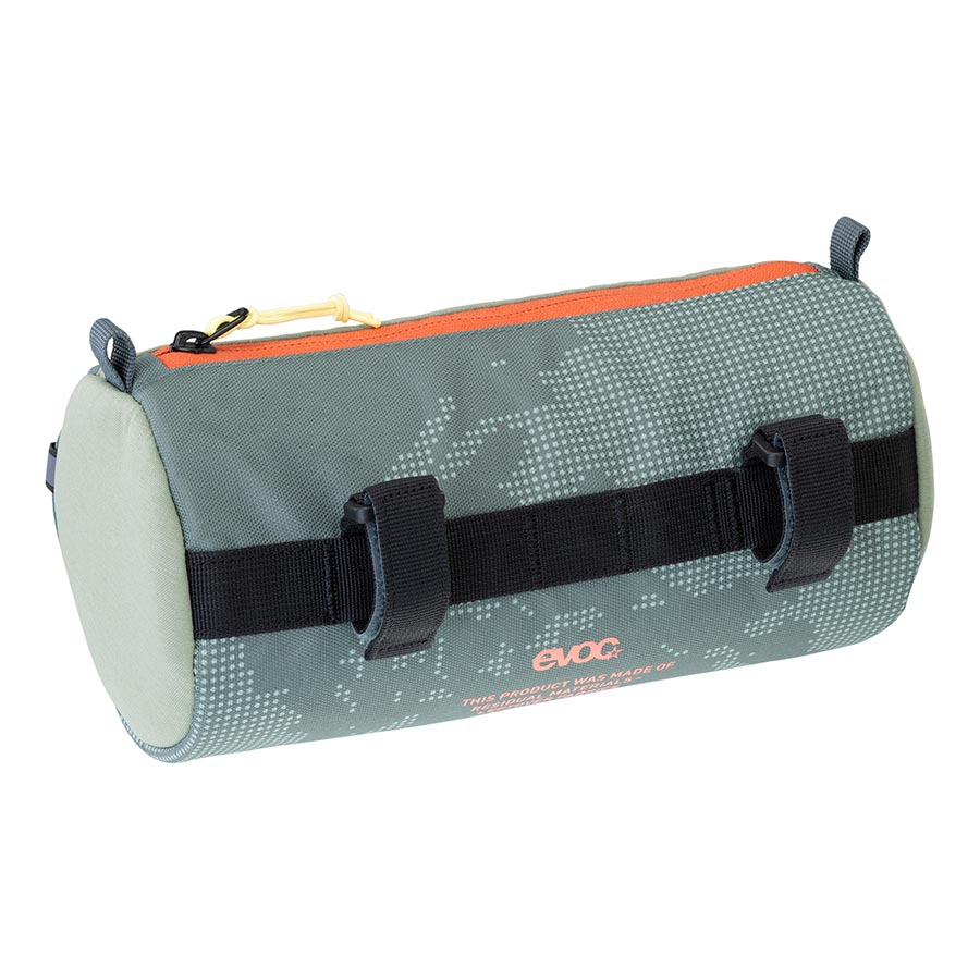 EVOC handlebar roll bag mounted on bicycle handlebar, showcasing durable outdoor gear for cycling storage.