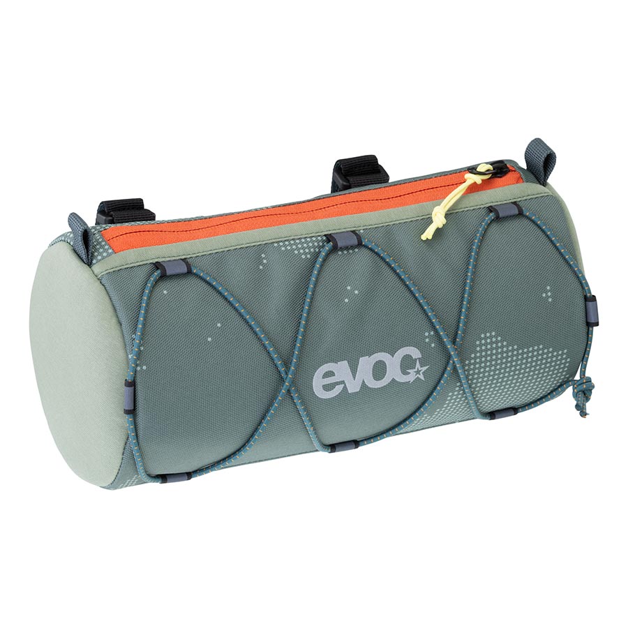 EVOC handlebar roll bag attached to a bicycle handlebar, compact and durable for bike storage and touring accessories.