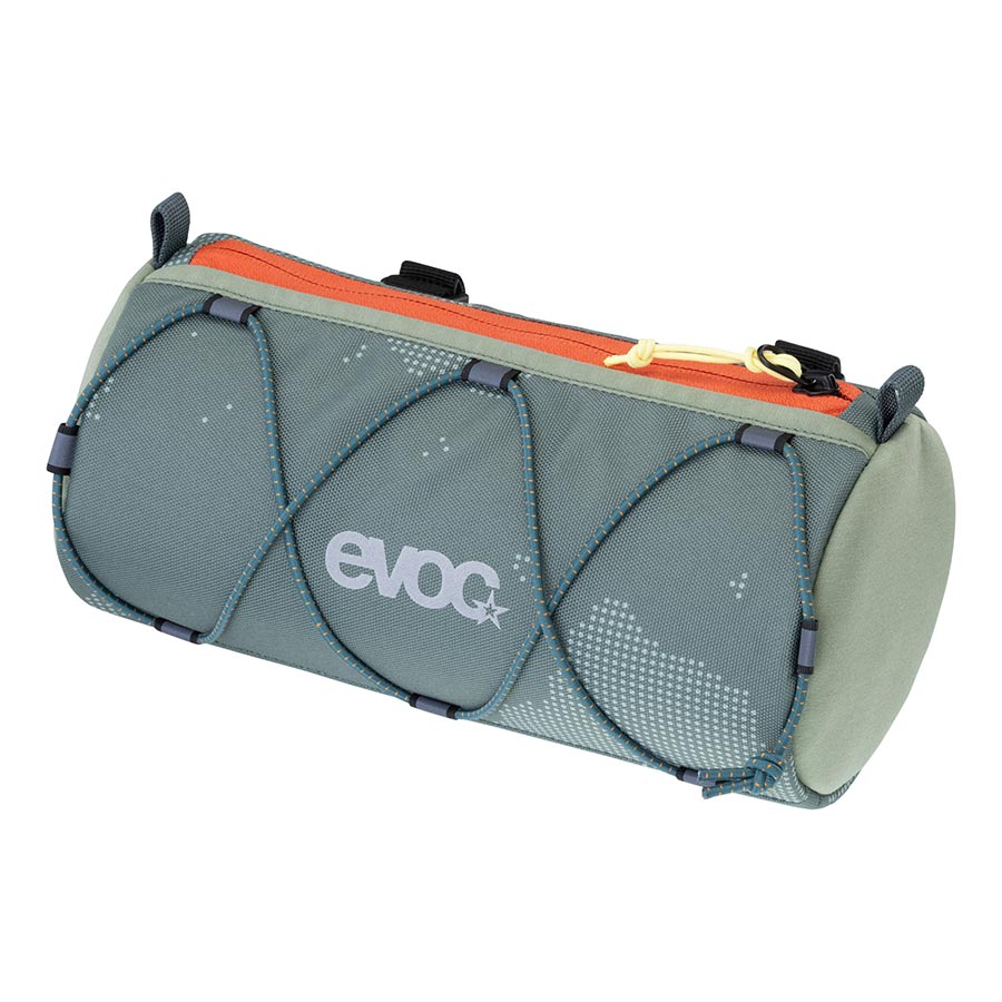 EVOC Handlebar Roll handlebar bag with multiple straps and storage compartments, mounted on a bicycle handlebar.