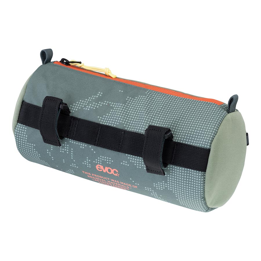 EVOC Handlebar Roll handlebar bag mounted on a bicycle, featuring durable straps and multiple compartments for bike touring gear.