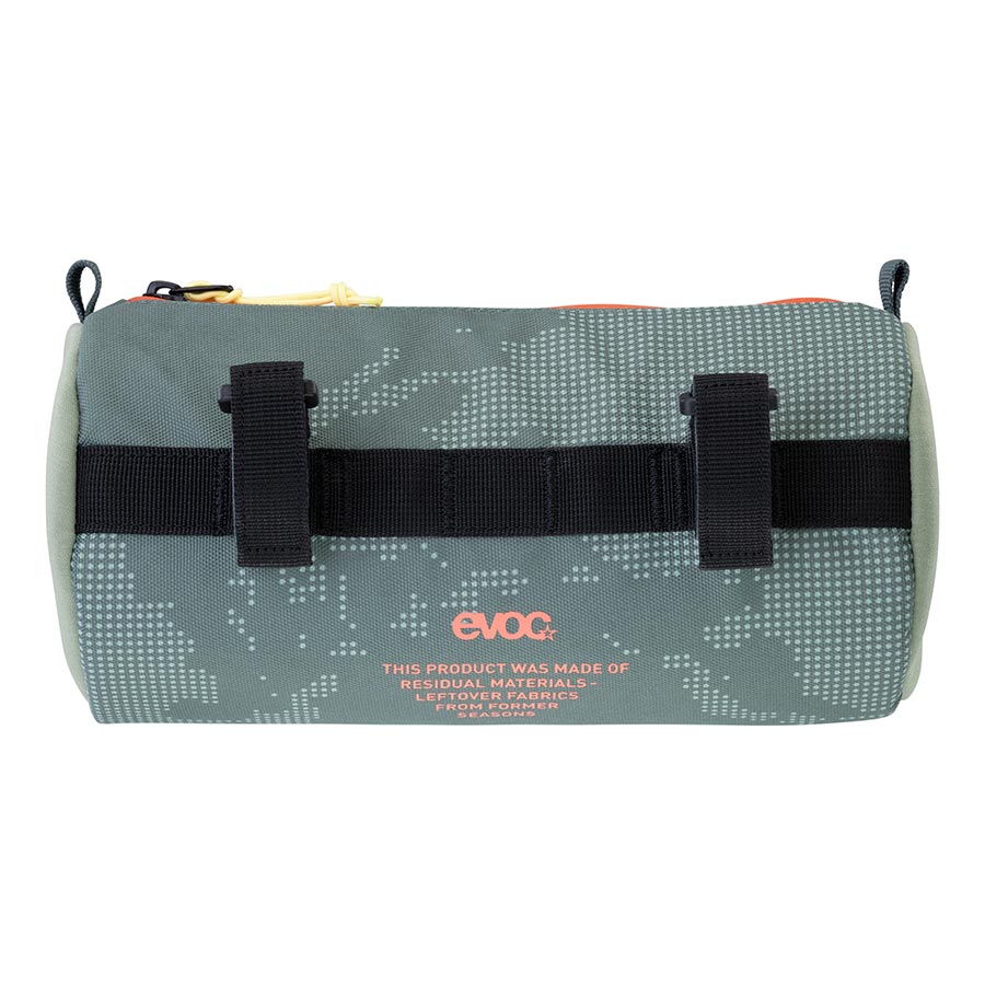 EVOC Handlebar Roll bike handlebar bag with multiple compartments, mounted on a bicycle handlebar for easy access and storage.
