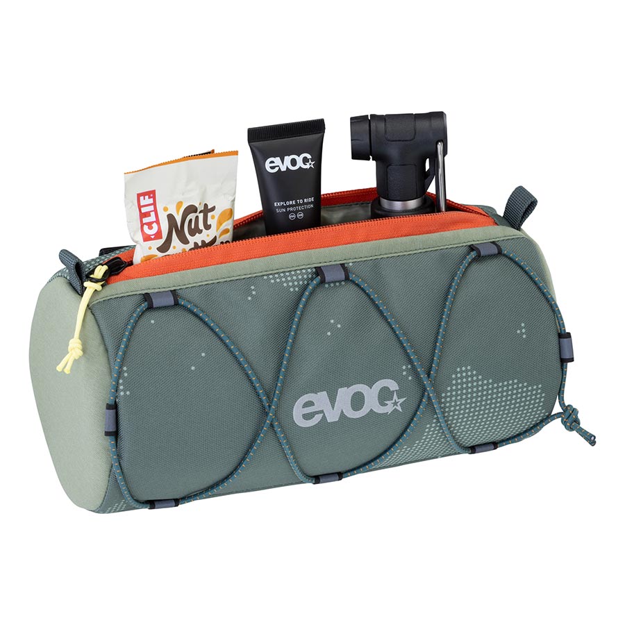 EVOC Handlebar Roll bag mounted on a bicycle handlebar, designed for cycling gear storage, with durable straps and compact profile