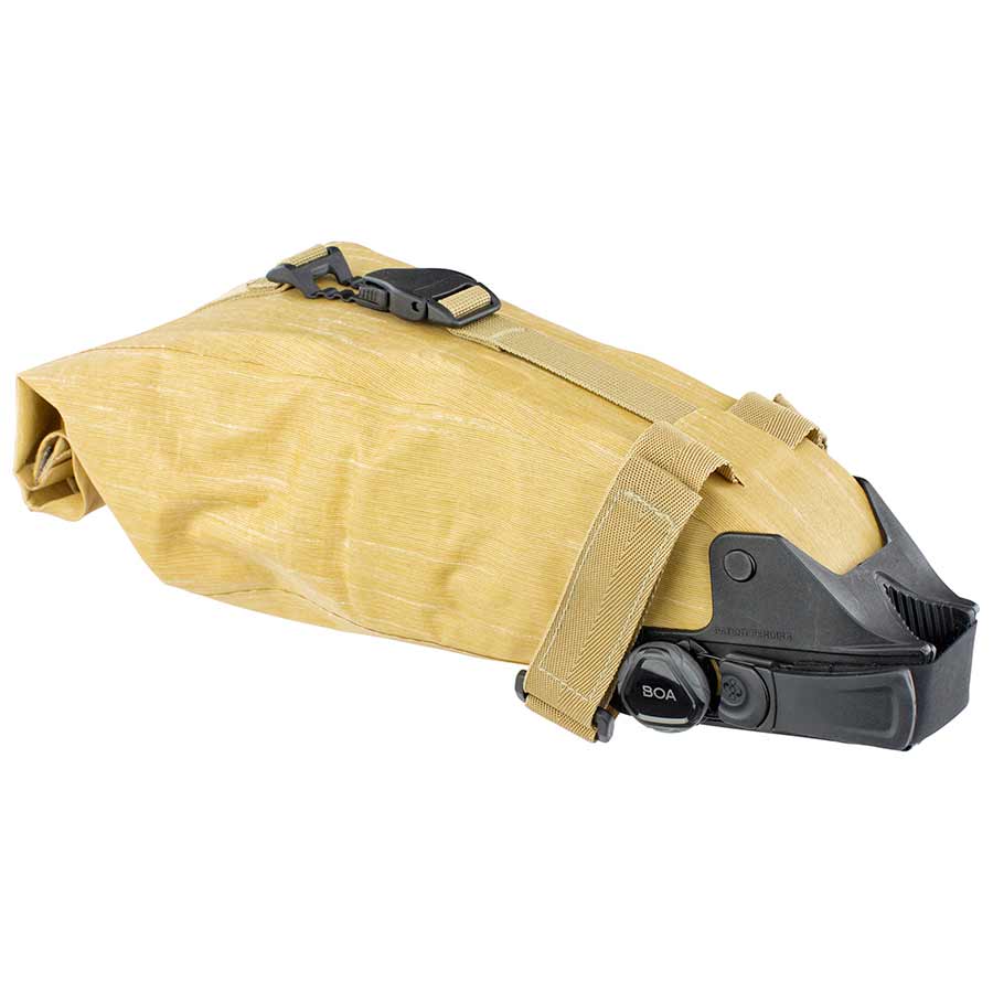 Grey EVOC Seat Pack Boa L seat bag attached to a bike saddle for easy storage during rides.