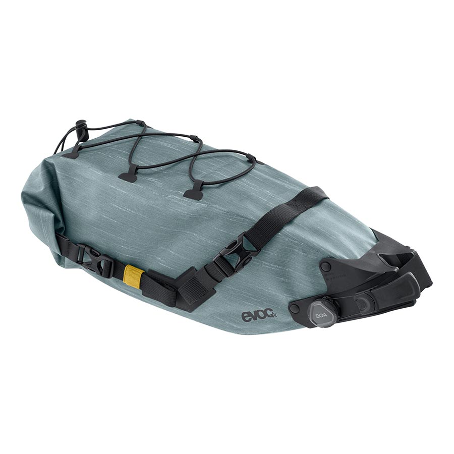 EVOC Seat Pack Boa WP, 12L carbon grey bike seat bag with waterproof design and secure strap system, mounted on bicycle saddle.