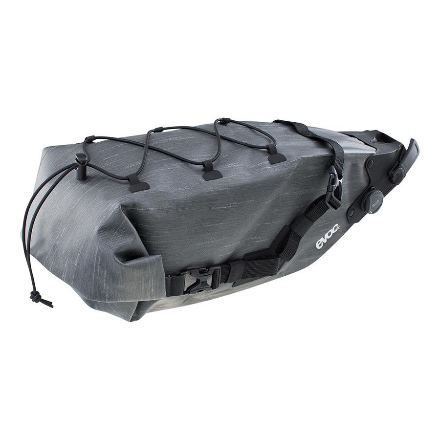 EVOC Seat Pack Boa WP 12L carbon grey seat bag attached to a bike, waterproof with secure fastening for cycling essentials.