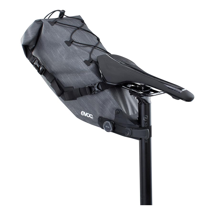 EVOC Seat Pack Boa WP seat bag in carbon grey, 12L capacity with waterproof design and secure fastening for bike riding.