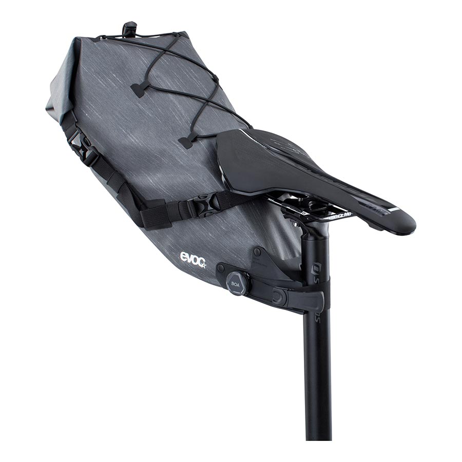EVOC Seat Pack Boa WP seat bag in carbon grey, 12L waterproof design with secure straps for bike storage.