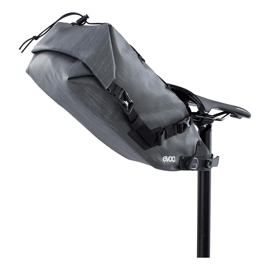 EVOC Seat Pack Boa WP seat bag in 12L, carbon grey, with waterproof design and secure strap system for bike storage.