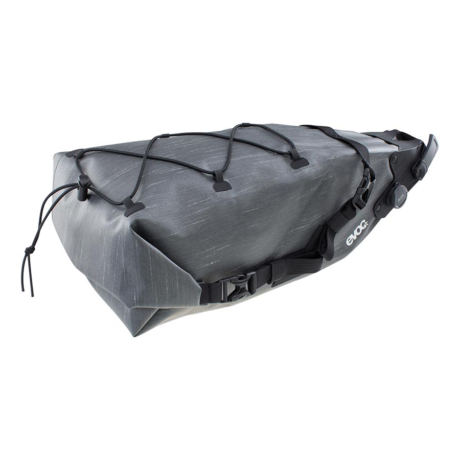 EVOC Seat Pack Boa WP seat bag in carbon grey, 12L capacity, waterproof design, mounted on bike saddle for cycling adventures.