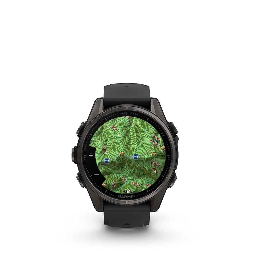 Garmin Fenix 8 AMOLED Sapphire 43mm watch with black bezel and pebble gray silicone wristband on a person's wrist.