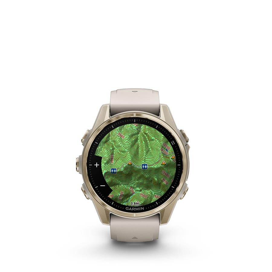 Garmin Fenix 8 AMOLED Sapphire 43mm smartwatch with black pebble gray silicone band on a person's wrist.