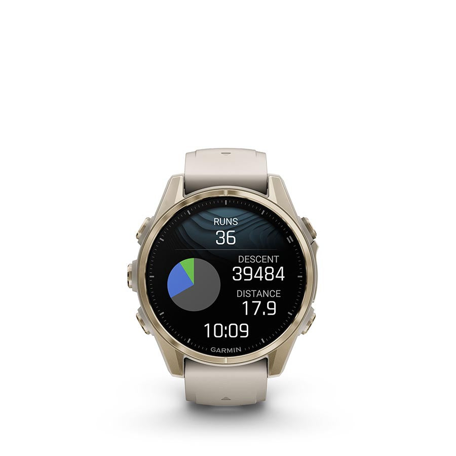 Garmin Fenix 8 AMOLED Sapphire 43mm watch with black pebble gray silicone wristband on a person's wrist.