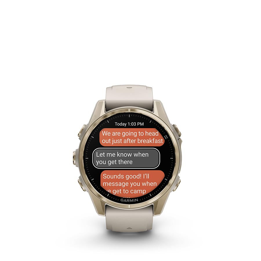 Garmin Fenix 8 AMOLED Sapphire 43mm smartwatch with grey silicone strap and black pebble gray bezel on a wrist.