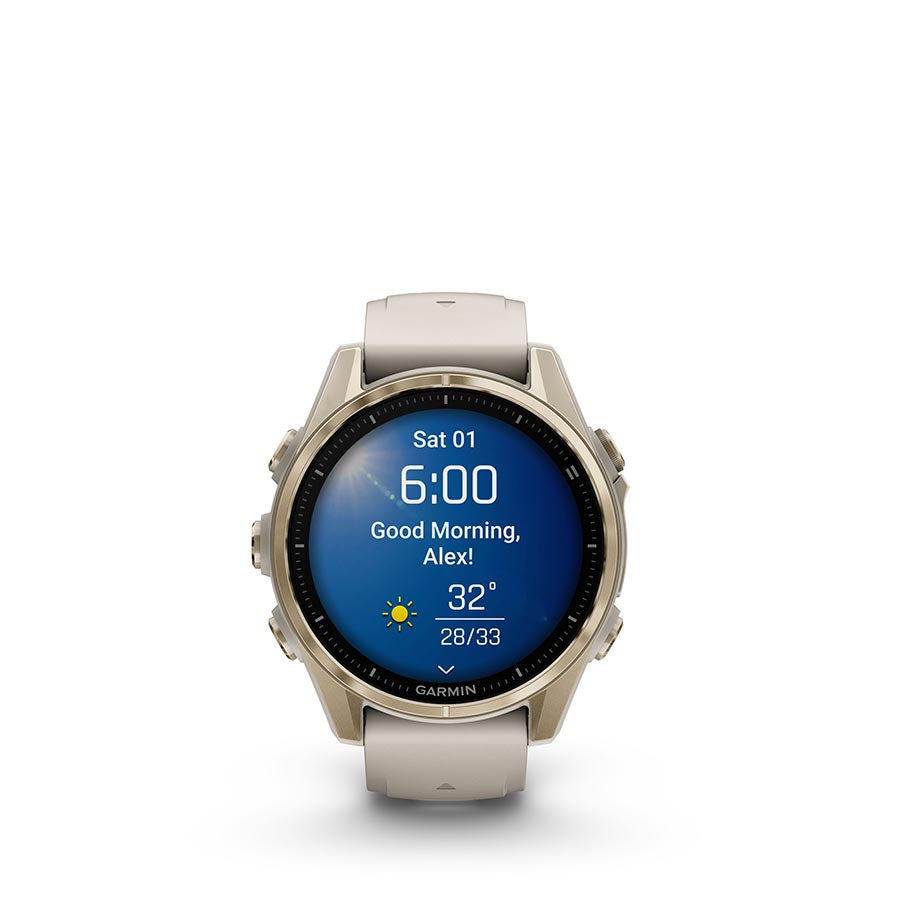 Garmin Fenix 8 AMOLED Sapphire 43mm smartwatch with grey silicone wristband on a black pebble gray background.