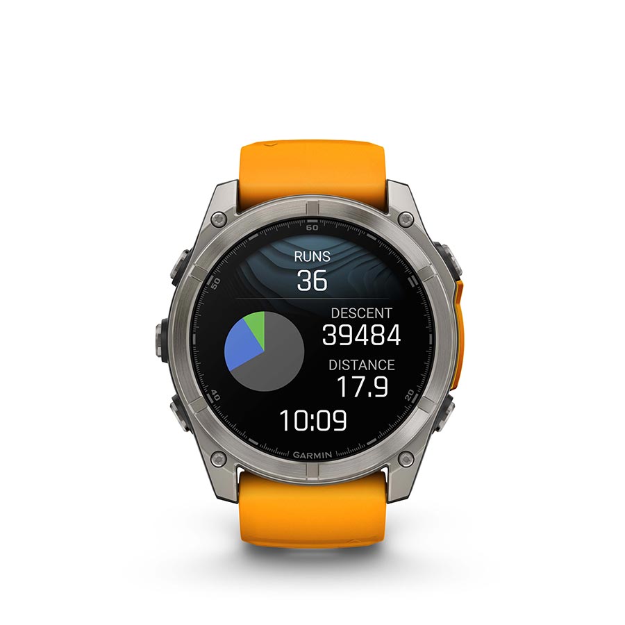 Garmin Fenix 8 AMOLED Sapphire 51mm watch with grey silicone strap, black bezel, and pebble gray dial on a person's wrist.