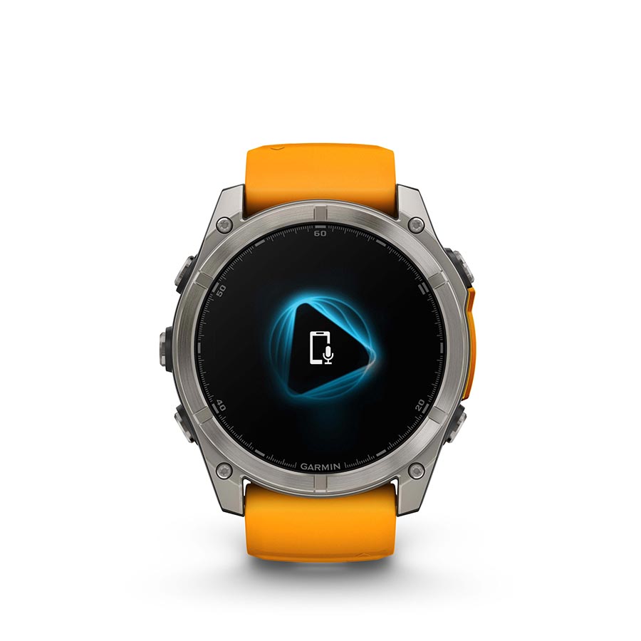 Garmin Fenix 8 AMOLED Sapphire 51mm smartwatch with a grey silicone wristband and black pebble bezel on a wrist.