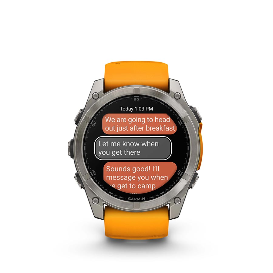 Garmin Fenix 8 AMOLED Sapphire 51mm smartwatch with grey silicone wristband and black bezel on a wrist.