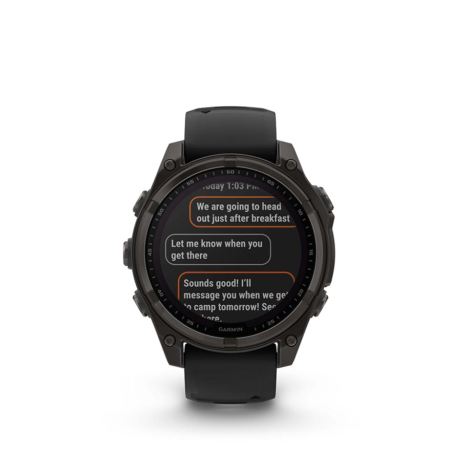 Garmin Fenix 8 Solar Sapphire 47mm watch with titanium wristband and yellow silicone strap, displayed on a wrist.