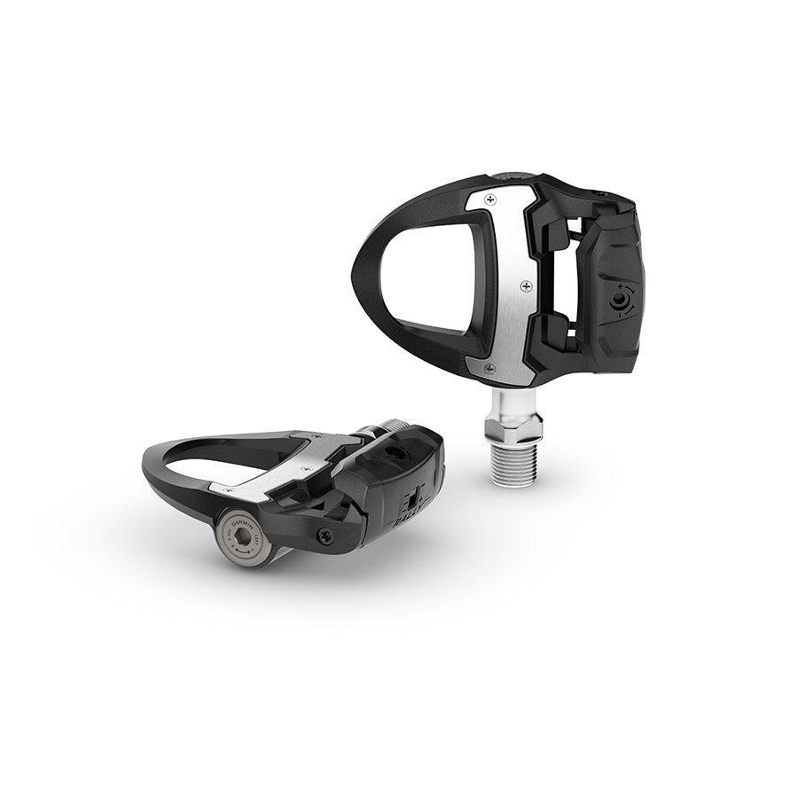 Garmin Rally RS clipless road pedals with black composite body and stainless steel spindle, single-sided design for cycling.