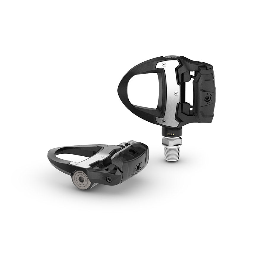 Garmin Rally RS clipless road pedals with black composite body and stainless steel spindle, single-sided design for cycling.