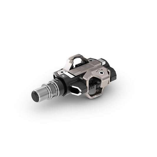 Garmin Rally RS/XC210 clipless road pedals with composite body, carbon spindle, and stainless steel components in black.