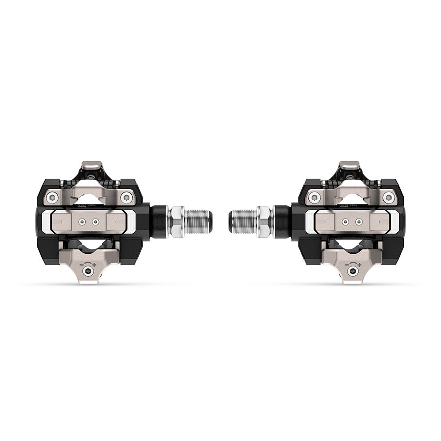 Garmin Rally XC clipless MTB pedals with carbon body, stainless steel spindle, black finish, single-sided design for mountain biking.