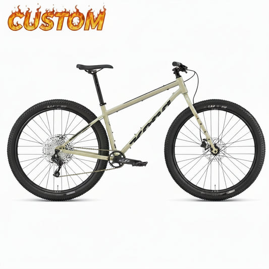 Kona Unit touring bike with custom build, black frame, flat handlebars, and gear shifters, shown from side view.