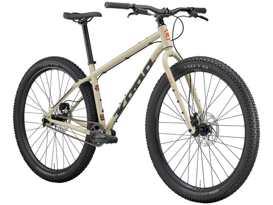 Kona Unit touring bike with custom build, featuring a sturdy frame, mountain tires, and multiple gears for off-road cycling.