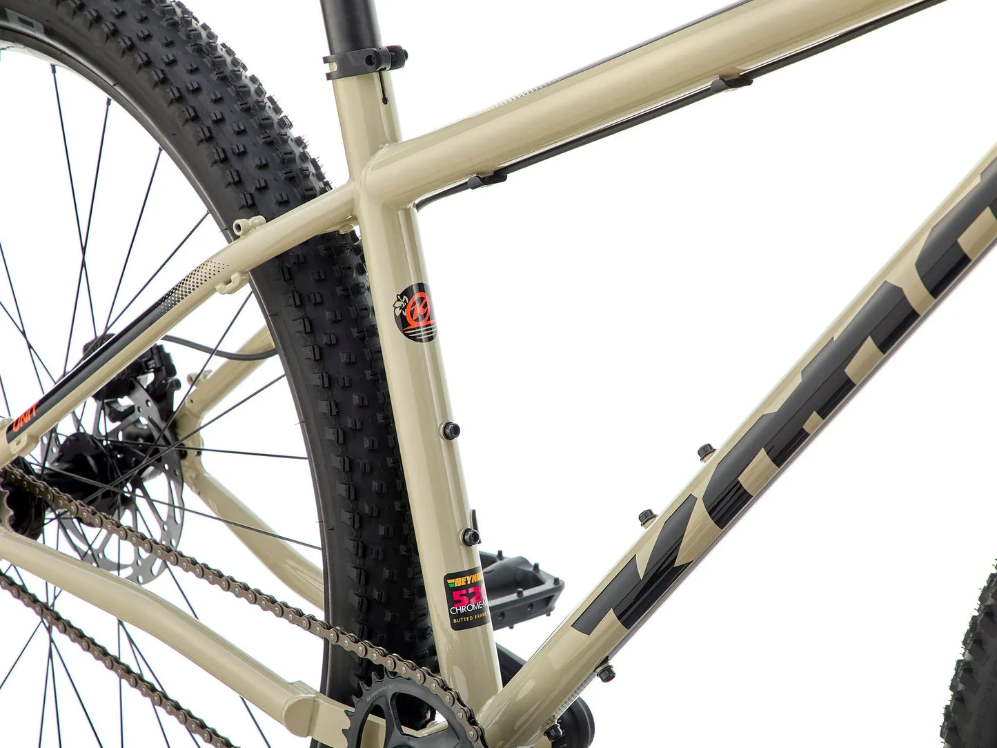 Kona Unit touring bike with custom build, featuring a sturdy frame, wide tires, and handlebars suitable for long-distance riding.