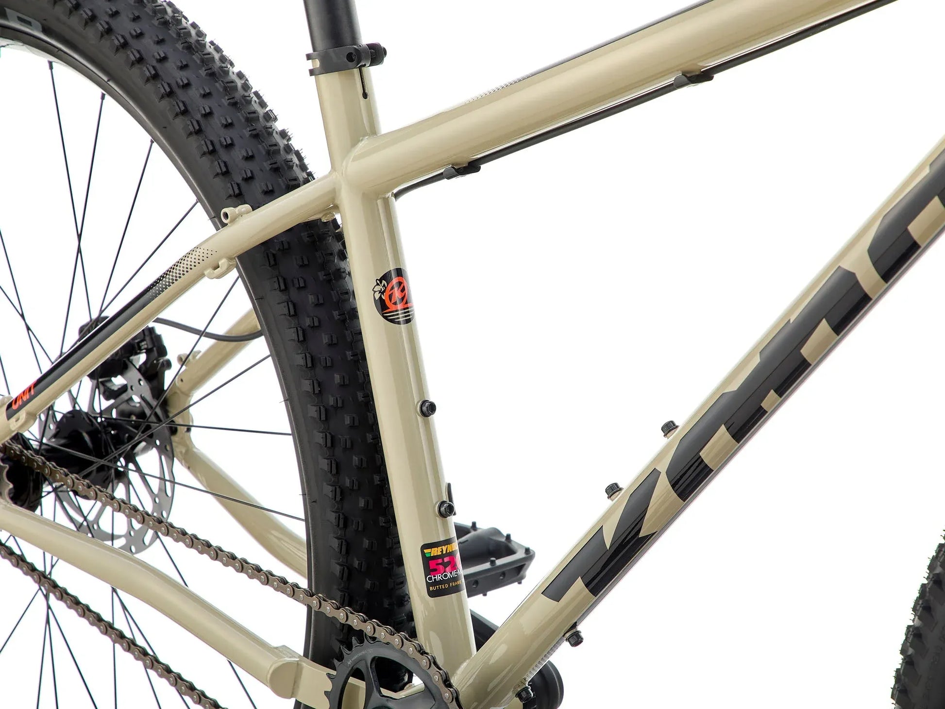 Kona Unit touring bike with custom build, featuring a sturdy frame, wide tires, and handlebars suitable for long-distance riding.