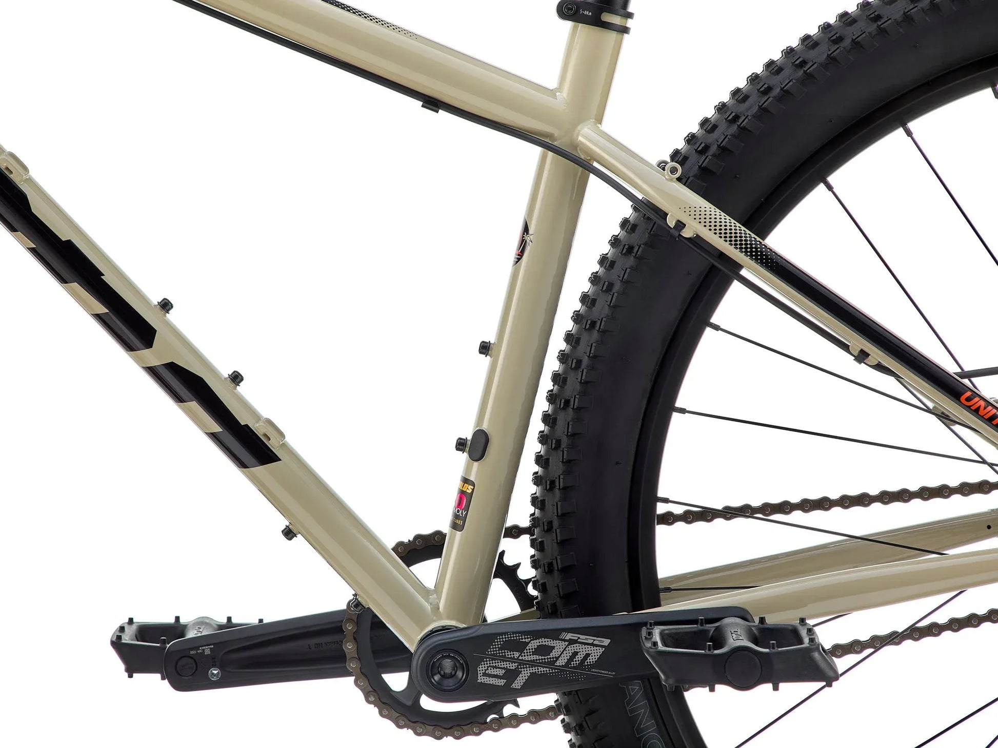 Kona Unit touring bike with custom build, featuring a lightweight frame, drop handlebars, and off-road tires for versatile riding.