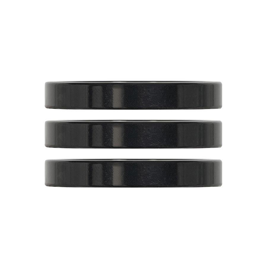 Set of three turquoise aluminum iRiX headset spacers by Industry Nine, 5mm height for bicycle handlebar assembly.