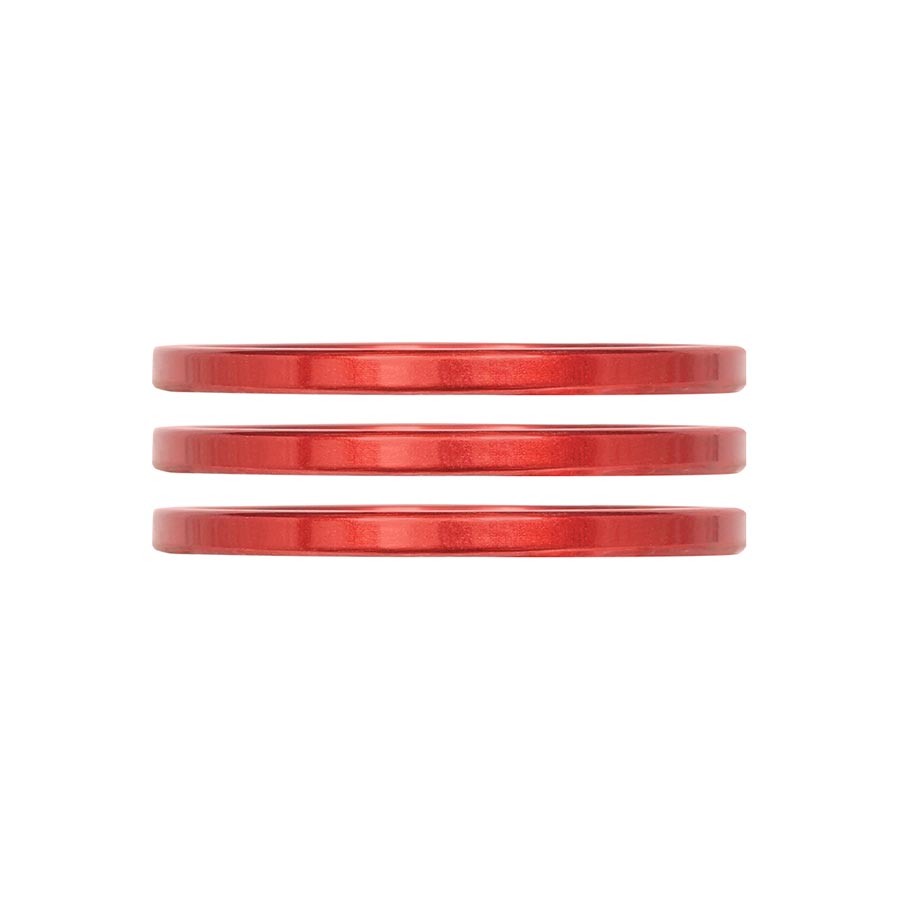 Set of three turquoise aluminum iRiX headset spacers by Industry Nine, 5mm thick, for mountain bike or road bike handlebars.