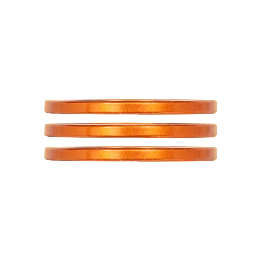 Industry Nine iRiX headset spacers set with three turquoise 5mm aluminum spacers for bike handlebars.