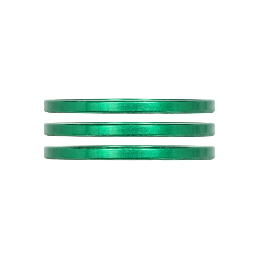 Set of three turquoise aluminum iRiX headset spacers by Industry Nine, 5mm height for bike handlebar and fork fitting.
