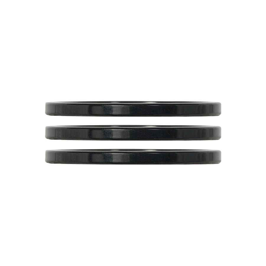 Industry Nine iRiX headset spacers in turquoise, 5mm aluminum spacers, set of three for mountain bike or bike headset assembly.