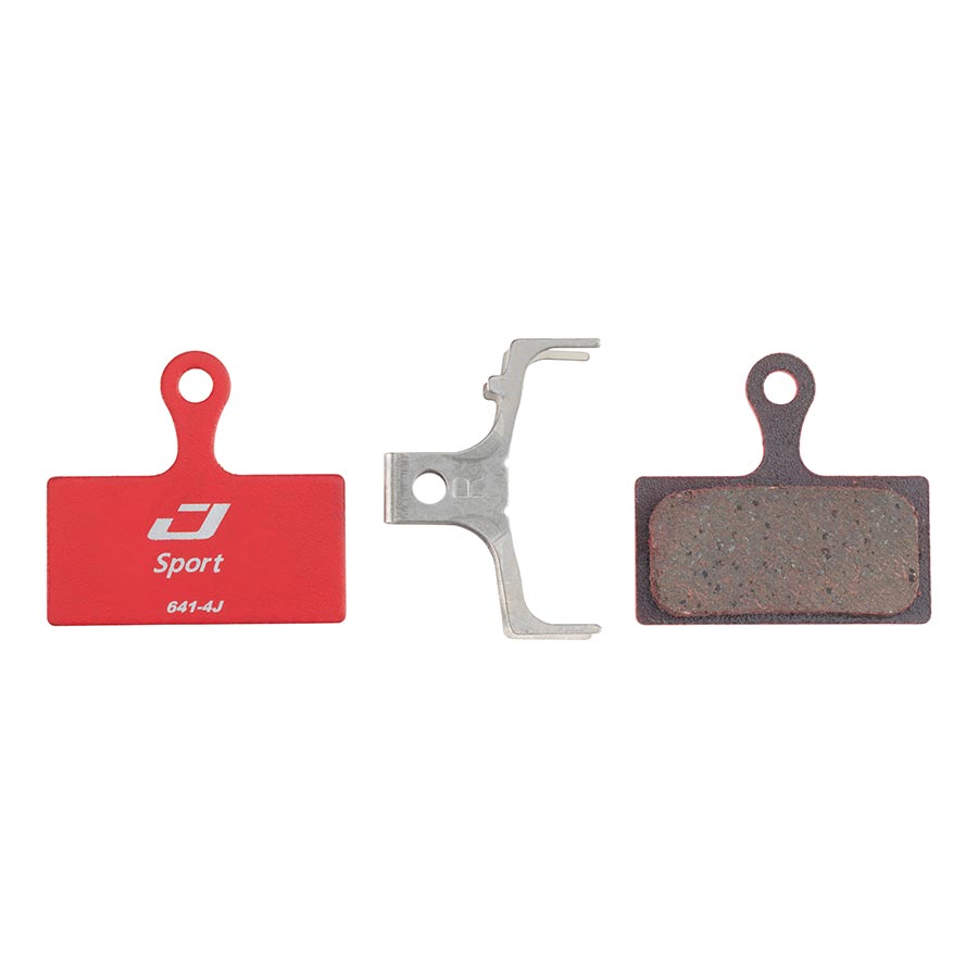 Jagwire Sport disc brake pads for mountain bikes, semi-metallic brake pads shown in close-up, designed for reliable stopping power.