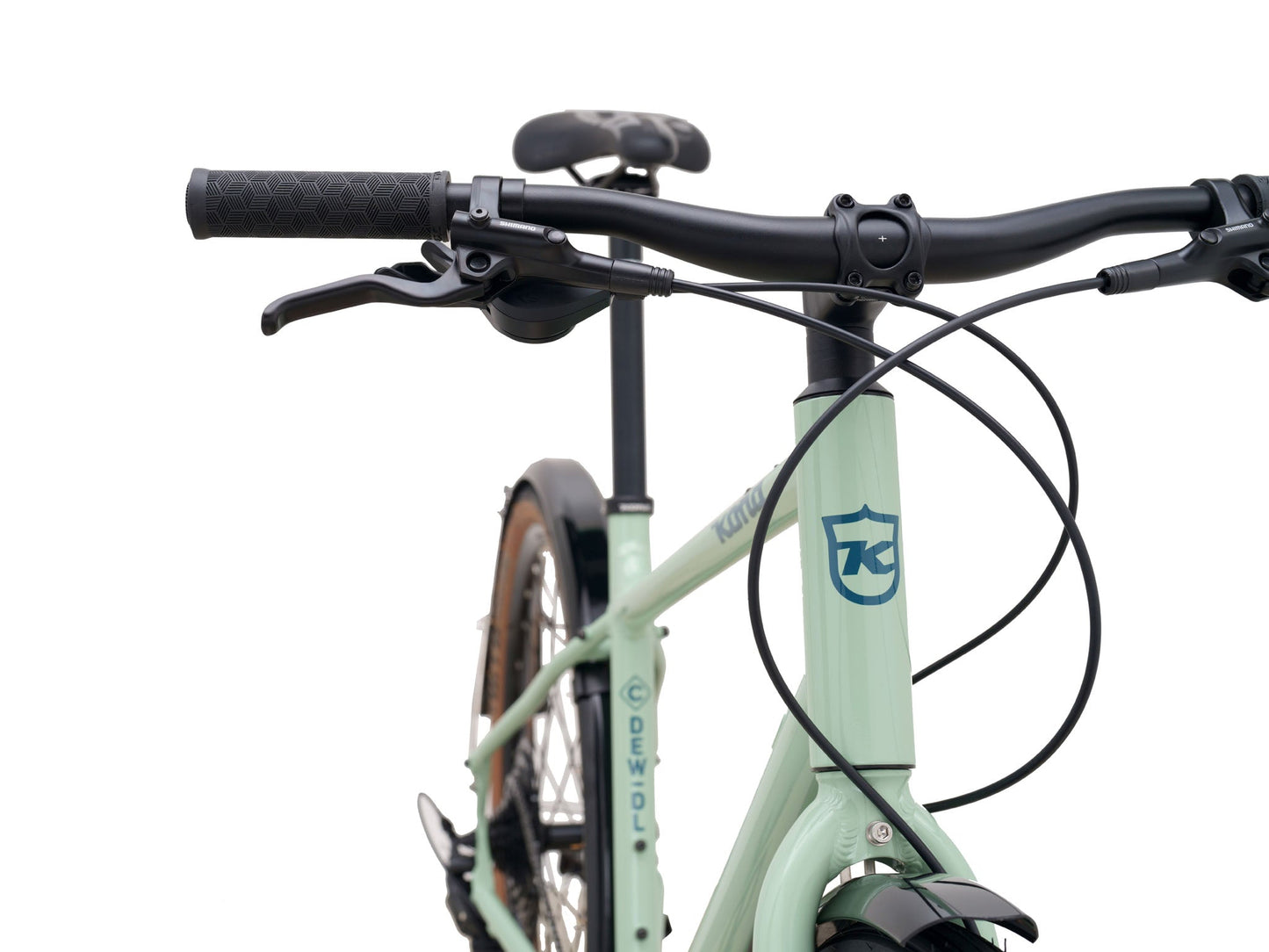 Kona Dew DL urban city bicycle with black frame, front suspension, and 700c wheels, designed for comfortable city commuting.