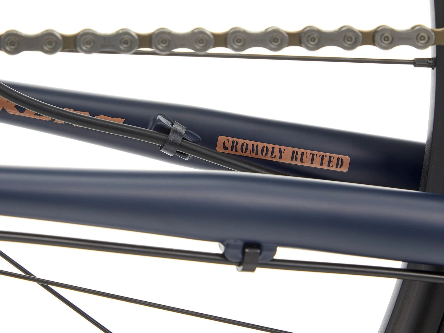 Kona Sutra touring bike with black frame, drop handlebars, and multiple gears, designed for long-distance cycling adventures.