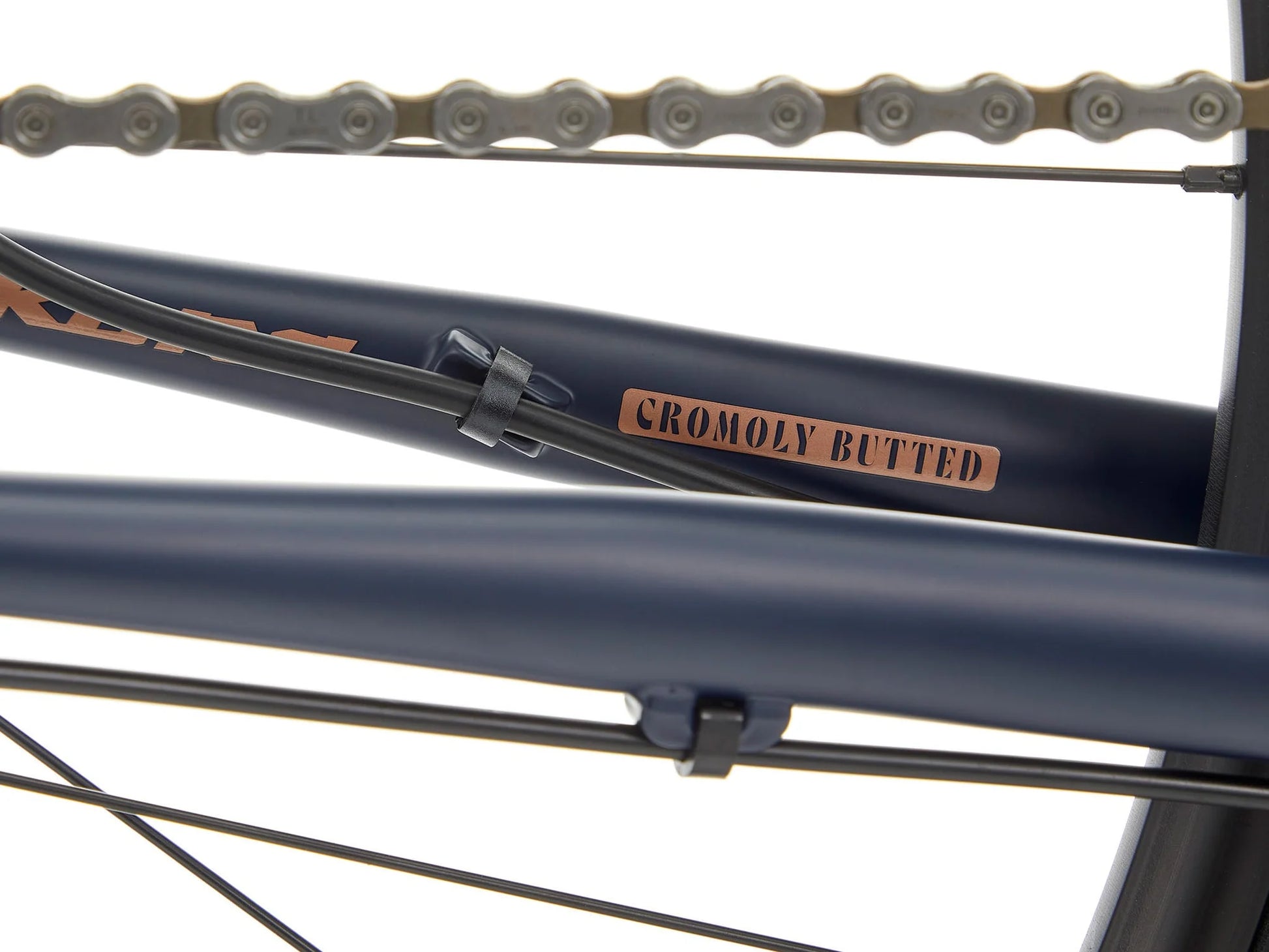 Kona Sutra touring bike with black frame, drop handlebars, and multiple gears, designed for long-distance cycling adventures.