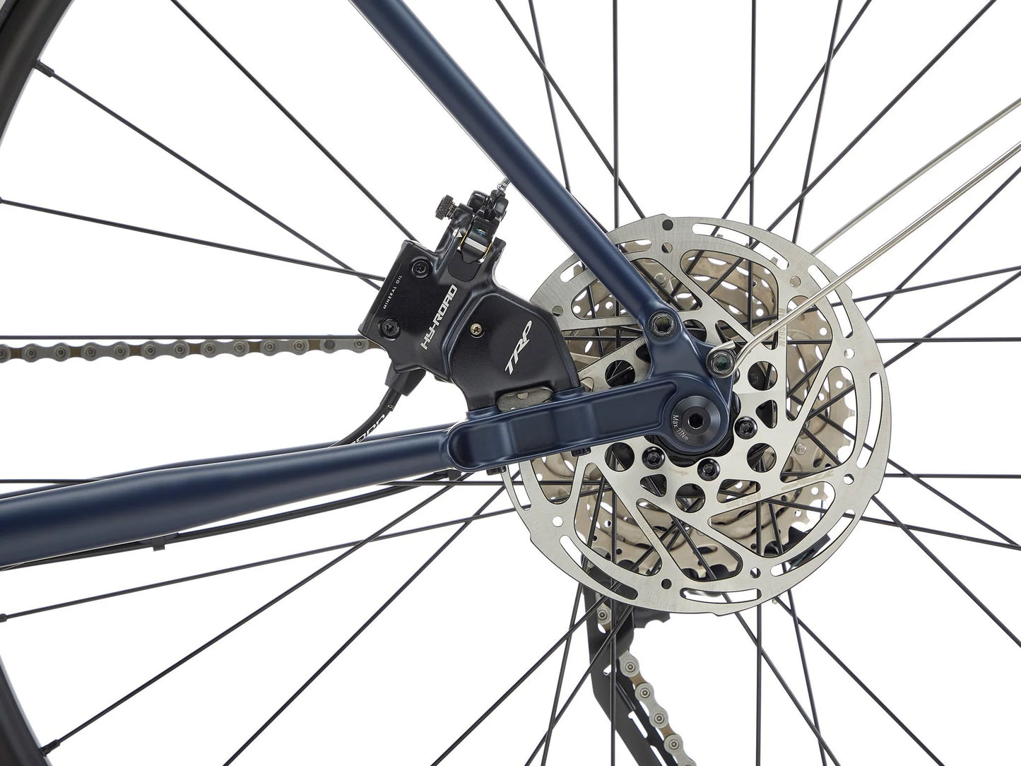 Kona Sutra touring bike with black frame, front and rear racks, equipped for long-distance cycling and adventure riding.