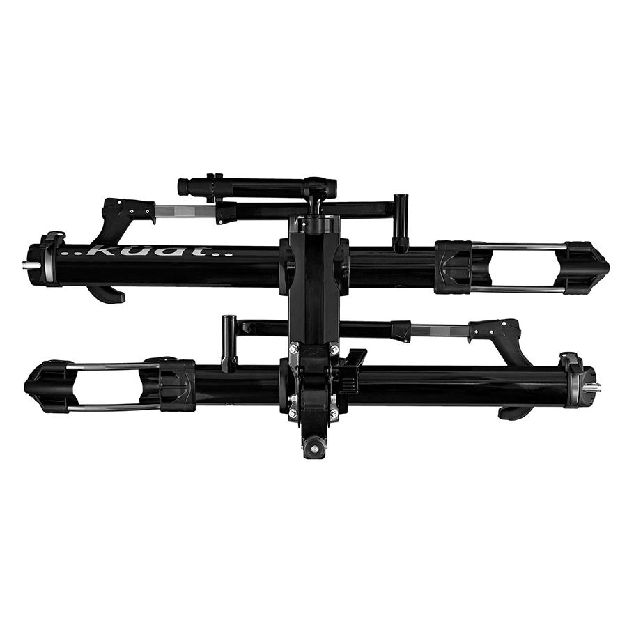 Kuat NV 2.0 hitch rack in gunmetal grey, 1-1/4 inch size, mounted on vehicle, showcasing its sturdy design and bike holding arms.