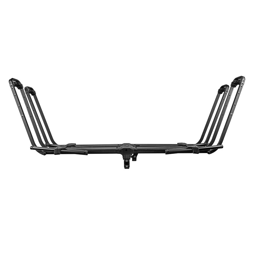 Kuat Piston Pro hitch rack in sandy black holding two bikes, designed for 1.25-inch hitch receivers with quick-release arms.