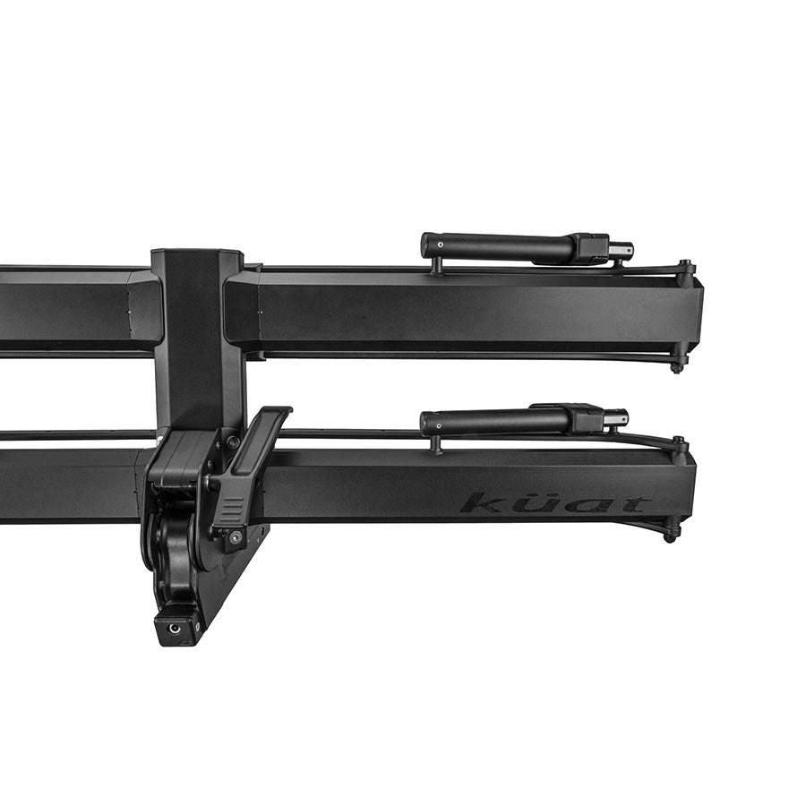 Kuat Piston Pro hitch rack holding two bikes, sandy black finish, designed for 1-1/4 inch hitches, sturdy and secure.