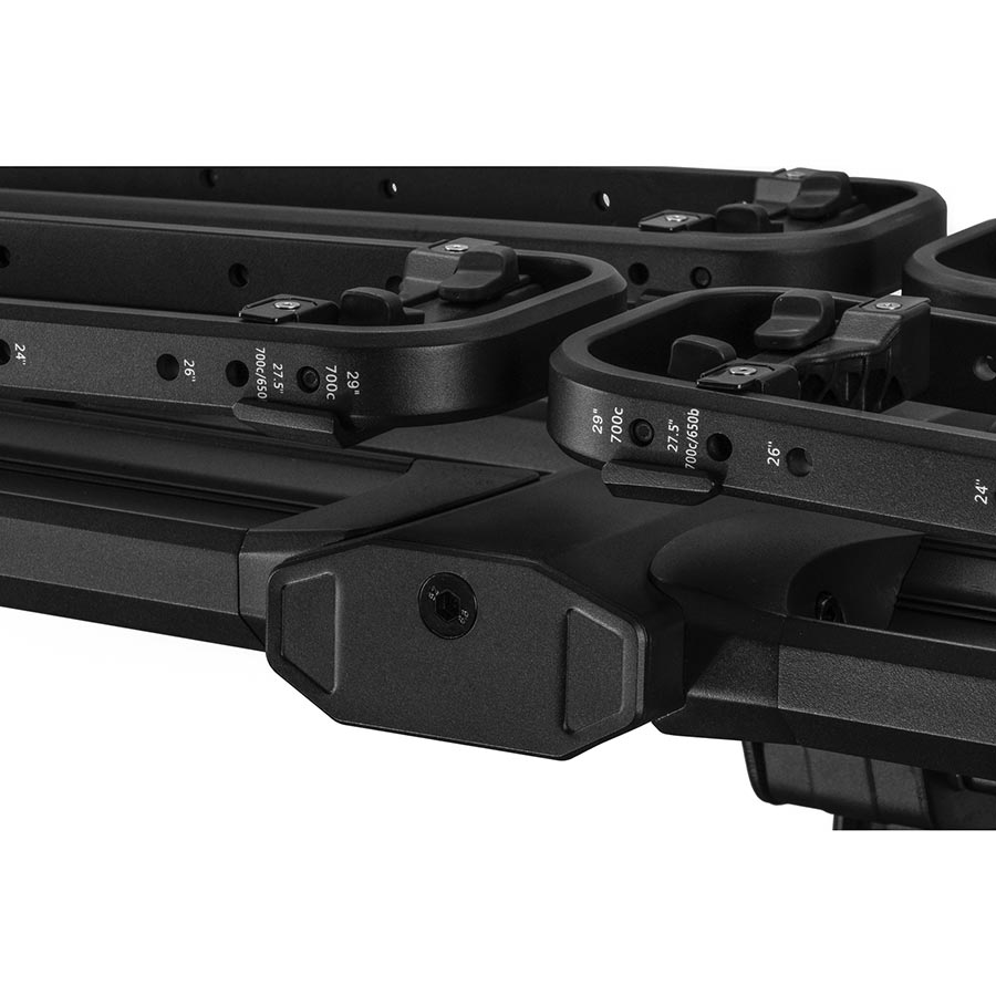 Kuat Piston Pro hitch rack in sandy black carrying two bikes, designed for 1.4-inch hitch receivers, with a sturdy, modern frame.