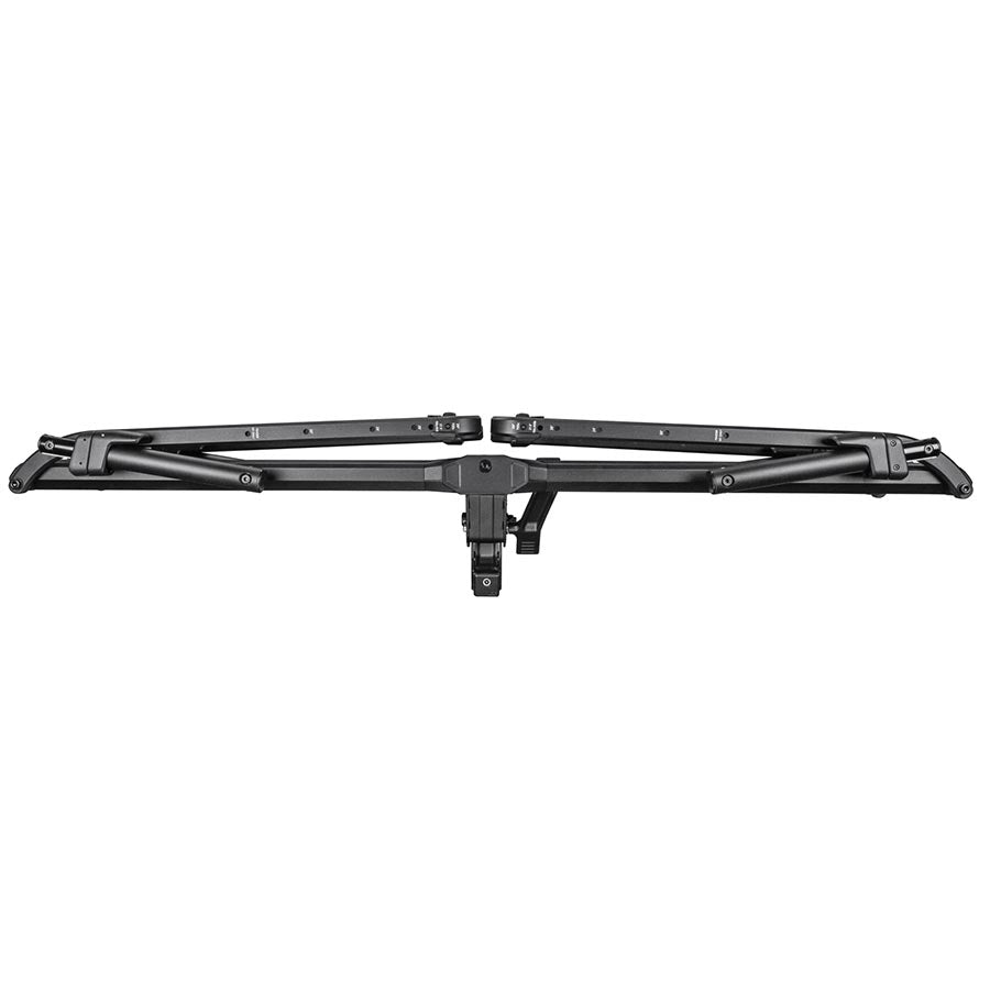 Kuat Piston Pro hitch rack in sandy black holding two bikes, designed for 1.25-inch hitch receivers, mounted on a vehicle.