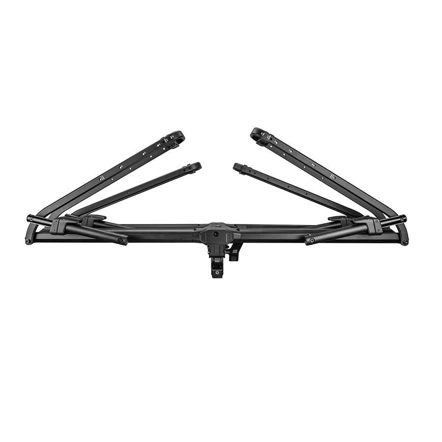 Kuat Piston Pro hitch rack in sandy black carrying two bikes, designed for 1.25-inch hitch receivers, with a sturdy, compact frame
