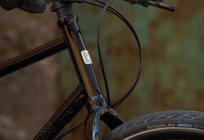Marin Muirwoods urban city bicycle in green and gold with a compact X-small frame, designed for city commuting and versatile riding.