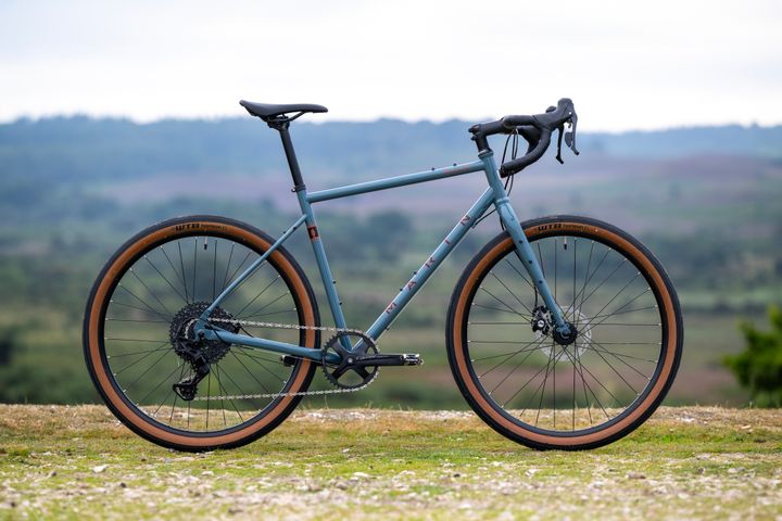 Grey Marin Nicasio+ gravel bike with 50cm frame, featuring a sturdy frame and off-road tires for versatile riding.