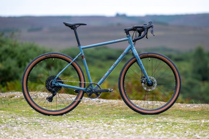 Marin Nicasio+ gravel bike in grey, 50cm frame, shown from side with knobby tires and drop handlebars.